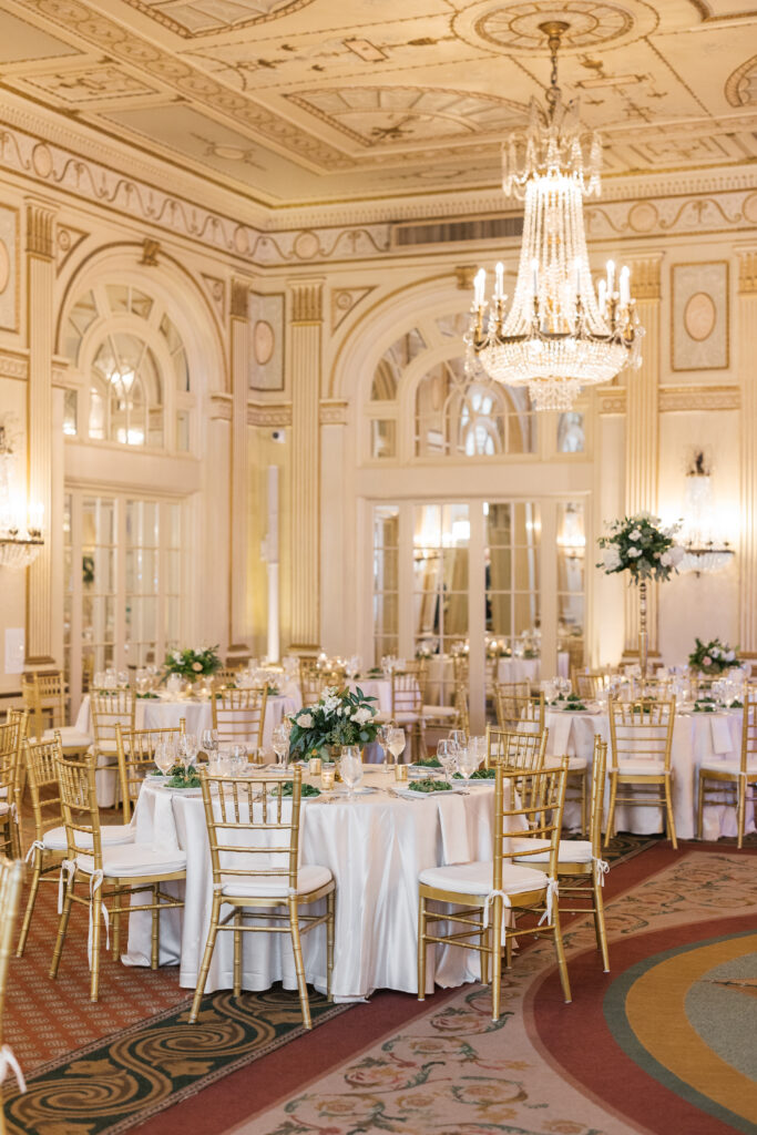 A wide photo shot of the ballroom at The Brown hotel. The reception décor was designed by wedding planner Events by Nikki.