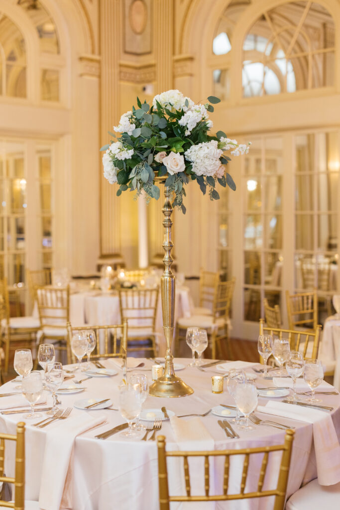 Close up of a classic floral arrangement on a table in the The Brown Hotel's Ballroom. The design is timeless and designed by Jamie Fairman. 