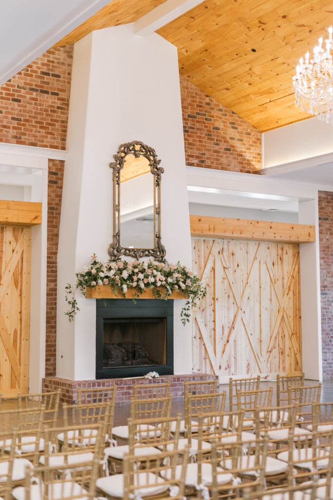 An indoor photo of the ballroom at Hazelnut farms. The room showecases the space before guest arrive. Christiana Burton Events designed the wedding and Jamie Fairmain placed the floral arragemenents. 