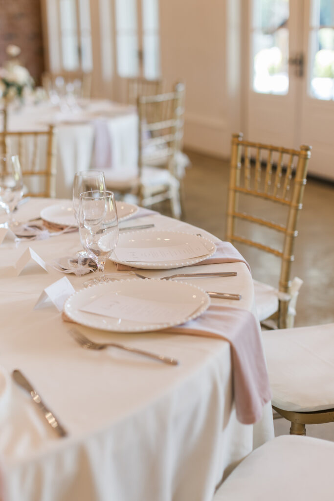 Soft pastel florals and refined table design by Christiana Burton at Hazelnut Farm wedding reception.